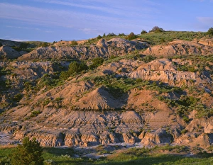 USA, North Dakota, Theodore Roosevelt National Park, Evening light defines eroded