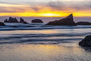 USA, Oregon, Bandon Beach. Pacific Ocean sea stacks at sunset