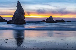 USA, Oregon, Bandon Beach. Pacific Ocean sea stacks at sunset