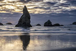USA, Oregon, Bandon Beach. Pacific Ocean sea stacks at sunset