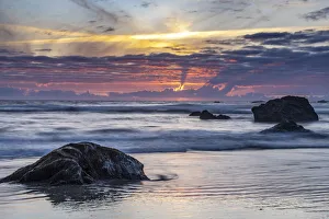 USA, Oregon, Bandon Beach. Pacific Ocean shoreline at sunset