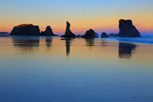USA, Oregon, Bandon. Sunset on beach sea stacks