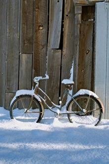 Images Dated 17th April 2006: USA, Oregon, Bend. An old bicycle sits covered in snow near a barn in Bend, Oregon