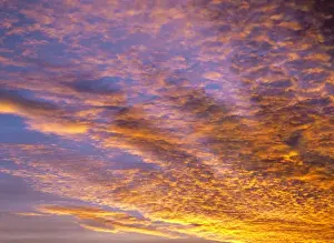 Sunray Prints: USA, Oregon, Bend. Sunset rolls across the sky like a brilliant tapesty