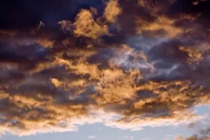 Atmosphere Prints: USA, Oregon, Bend. Wisps of clouds catch light from the setting sun in central Oregon