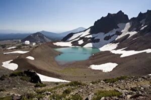 USA, Oregon, Broken Top. A glacial blue lake occupies the east side of Broken Top