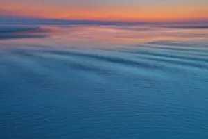USA, Oregon, Cannon Beach. Sunset blues with ripples sandy beach