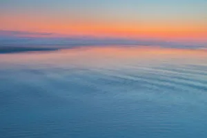 Moody Prints: USA, Oregon, Cannon Beach. Sunset blues with ripples sandy beach