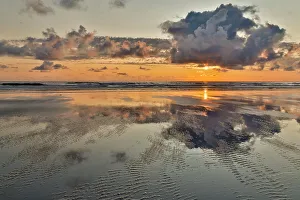 Cannon Beach Prints: USA, Oregon, Cannon Beach. Sunset golden colors with ripples sandy beach