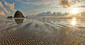 Cannon Beach Prints: USA, Oregon, Cannon Beach. Sunset golden colors with ripples in sandy beach and The Haystack Rock