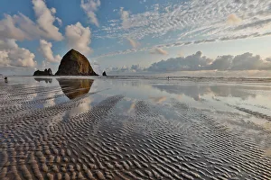 Cannon Beach Prints: USA, Oregon, Cannon Beach. Sunset golden colors with ripples in sandy beach and The Haystack Rock