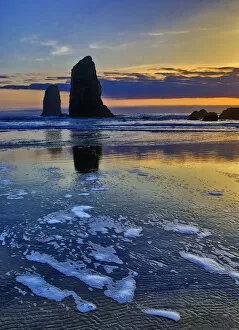 USA, Oregon, Cannon Beach. Sunset on The Sentinels sea stacks