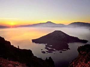 Images Dated 10th January 2013: USA, Oregon, Crater Lake National Park. Sunrise over Crater Lake and Wizard Island