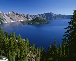 USA, Oregon. Crater Lake National Park, Wizard Island and Crater Lake with a grove