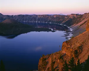 USA, Oregon. Crater Lake National Park, sunrise light on Wizard Island, view south