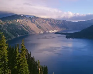 USA, Oregon, Crater Lake National Park. Morning clouds hover over west rim of Crater Lake