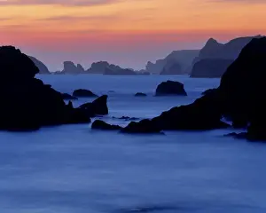 Outcrop Prints: USA, Oregon, Harris Beach SP. A long exposure creates a misty effect at sunset
