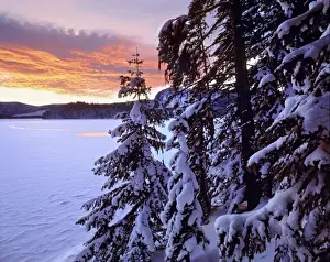Frigid Prints: USA, Oregon, Newberry NVM. Sunset colors the clouds above Paulina Lake