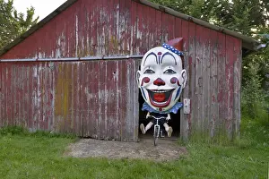Mask Prints: USA, Oregon, Oregon City. Clown face on bike in door of red barn