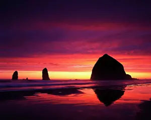 USA, Oregon, Oregon Coast, View of Haystack Rock on Cannon beach at sunset