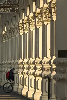 Images Dated 5th July 2006: USA, Oregon, Portland, bicyclist riding through columns on Ankeny street