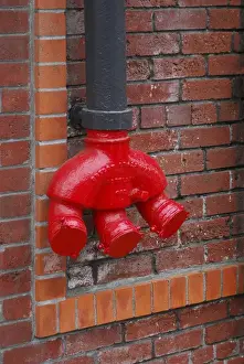 Images Dated 24th November 2007: USA, Oregon, Portland. Bright red standpipe outside of brick building. Credit as