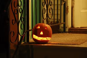 Images Dated 31st October 2007: USA, Oregon, Portland. Lighted jack-o-lantern on front porch awaiting trick or treaters