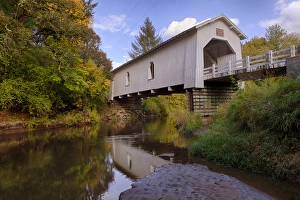 USA, Oregon, Scio, Hoffman Bridge across Crabtree Creek in early Autumn. Digital Composite