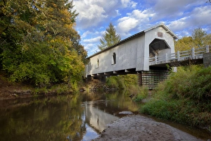 USA, Oregon, Scio, Hoffman Bridge across Crabtree Creek in early Autumn. Digital Composite
