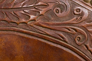 USA, Oregon, Seneca, Ponderosa Ranch. Tooled leather details on a saddle