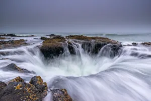 Cloudy Prints: USA, Oregon. Thors Well and ocean at sunset