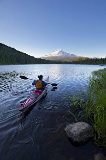 Images Dated 6th July 2011: USA, Oregon. A woman in a sea kayak paddles on Trillium Lake