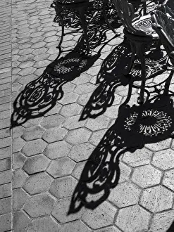 Wrought Iron Prints: USA, Pennsylvania. Wrought iron chairs and shadows on a patio on a sunny day