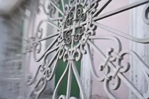 Blurred Prints: USA, Puerto Rico, Ponce. Traditional colonial architecture with wrought-iron grill (blurred)