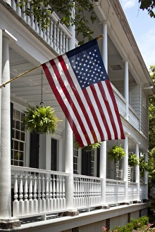 Images Dated 21st June 2009: USA, South Carolina, Charleston, American flag flies from porch of historic home