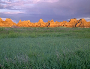 South Dakota Prints: USA, South Dakota, Badlands National Park, Sunrise light on eroded pinnacles above