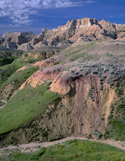 South Dakota Prints: USA, South Dakota, Badlands National Park, North Unit, Pinnacles rise above grass