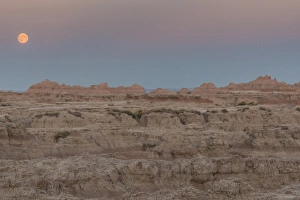Images Dated 8th September 2014: USA, South Dakota. Moonrise in Badlands National Park