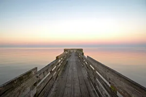 USA, Texas. Pier on Trinity Bay, calm sunrise