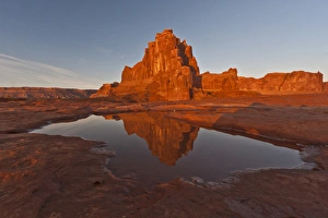 USA, Utah, Arches National Park, La Sal Overlook. Rock formation reflected in rain puddle