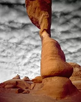 Images Dated 25th October 2007: USA, Utah, Arches National Park. Portion of Delicate Arch against clouds. Credit as