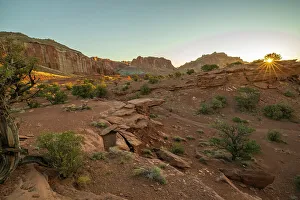 Images Dated 4th October 2022: USA, Utah, Capitol Reef National Park. Sunrise sunburst on landscape