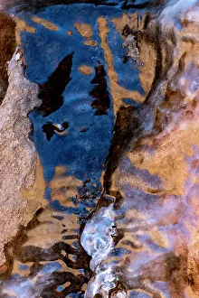 Images Dated 20th June 2023: USA, Utah. Ice formations with sky and canyon wall reflections, Arches National Park