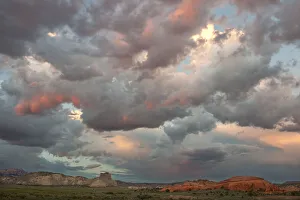 Images Dated 2021 July: USA, Utah. Landscape with sandstone formations and clearing storm clouds at sunset