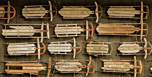 Vermont Prints: USA, Vermont. Side of barn mounted with old wooden sleds as decor