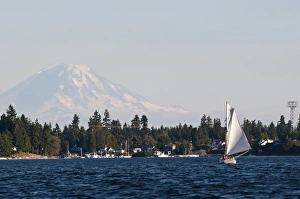 Images Dated 3rd September 2012: USA, WA, Poulsbo. Gaff rigged sailboat navigates Liberty Bay with Mt Rainier looming