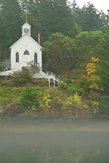 Marina Prints: USA, WA, San Juan Island. Fall color and fog accent quaint Roche Harbor chapel