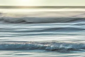 Aqua Prints: USA, Washington, Cape Disappointment State Park. Motion blur of sunset on coast. Credit as
