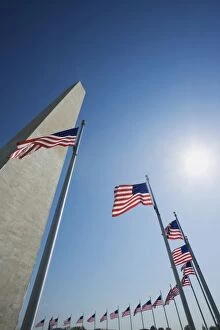 USA, Washington, D.C. American flags surround the Washington Monument