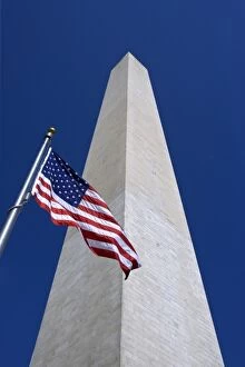 USA, Washington, D.C. View of American flag and the Washington Monument obelisk